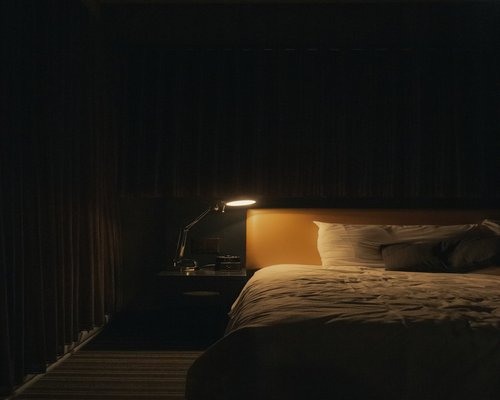 Comfortable bedroom with soft evening light setup